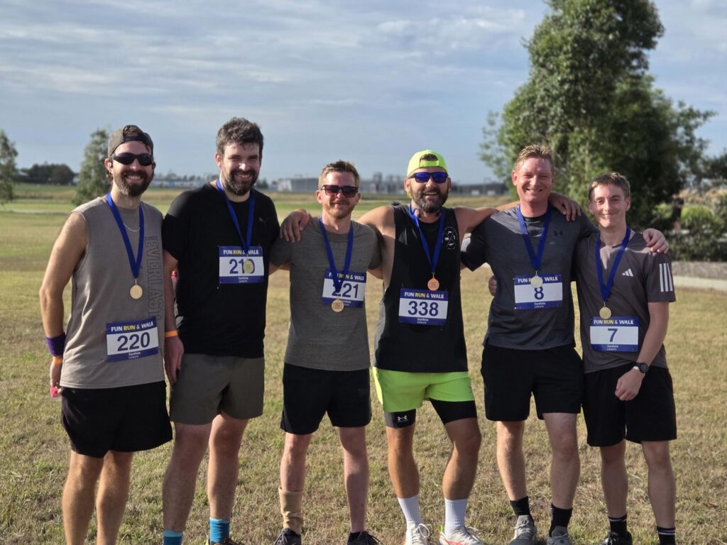 Participants wearing medals after the Cardinia Fun Run and Walk